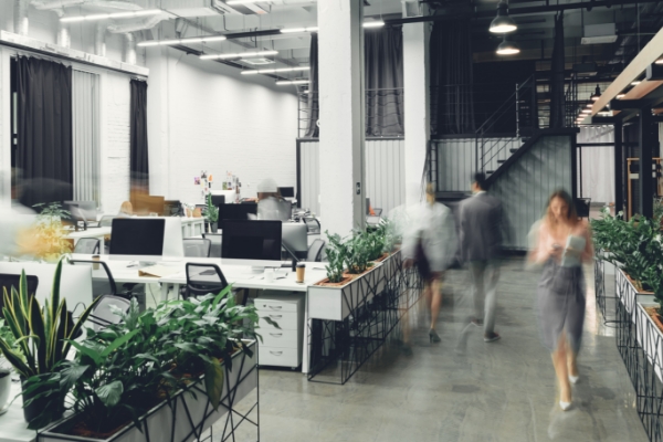 Employees walking through an office.